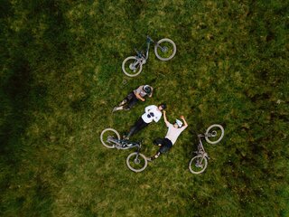 Cyclist taking a break on the meadow