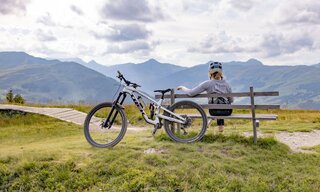 Cyclist sitting on a bench