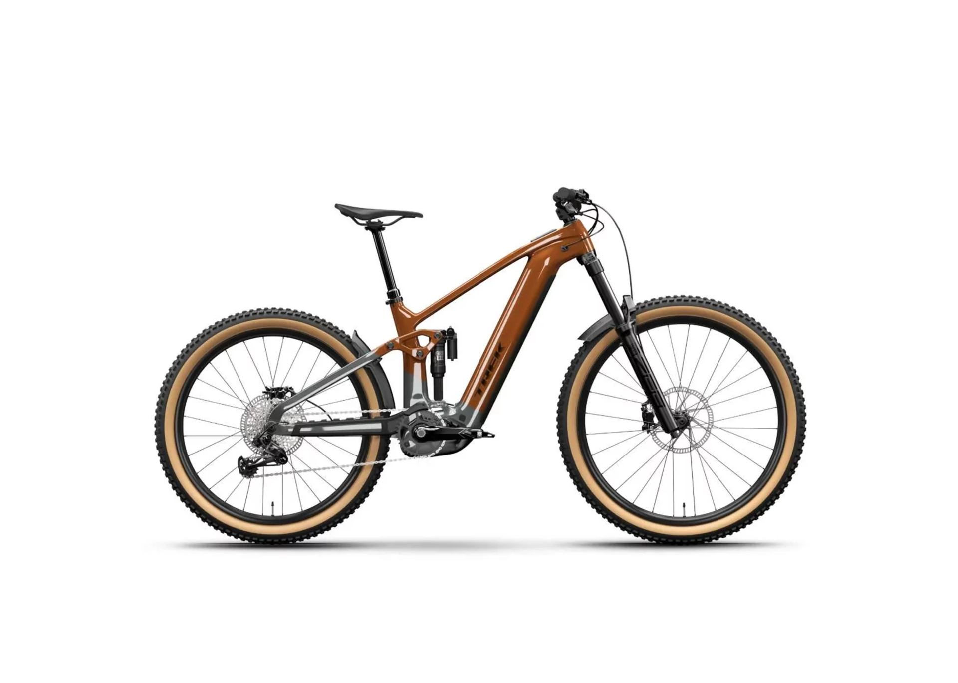 A sleek, brown mountain bike with thick tires and a sturdy frame, positioned against a white background. The bike exudes a sporty, adventurous vibe.