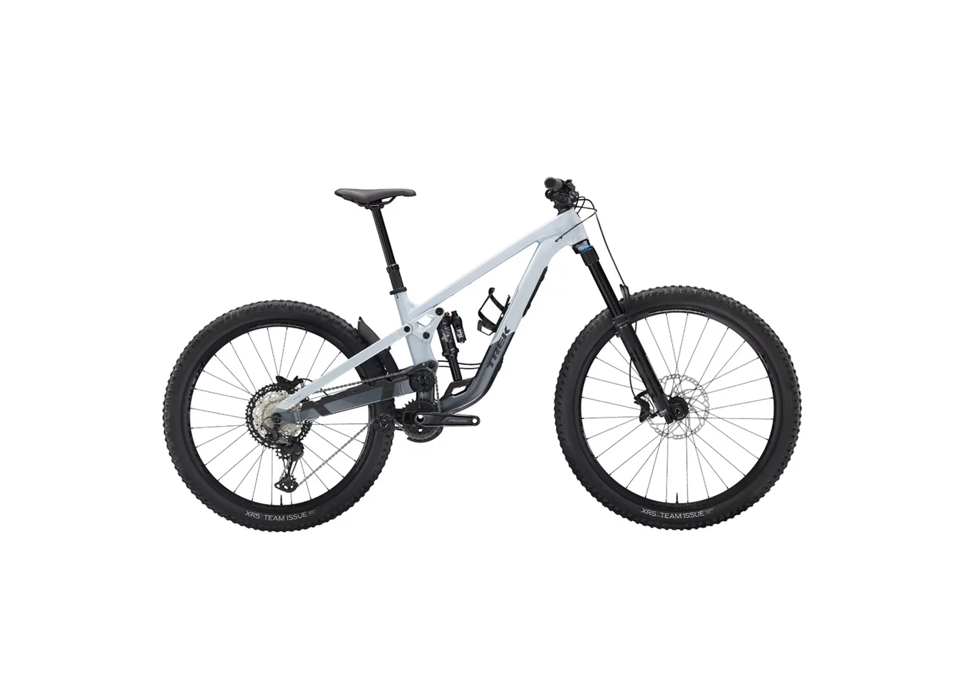 A sleek, modern mountain bike with a light gray frame is shown in profile. It features a robust suspension system and large, thick tread tires.